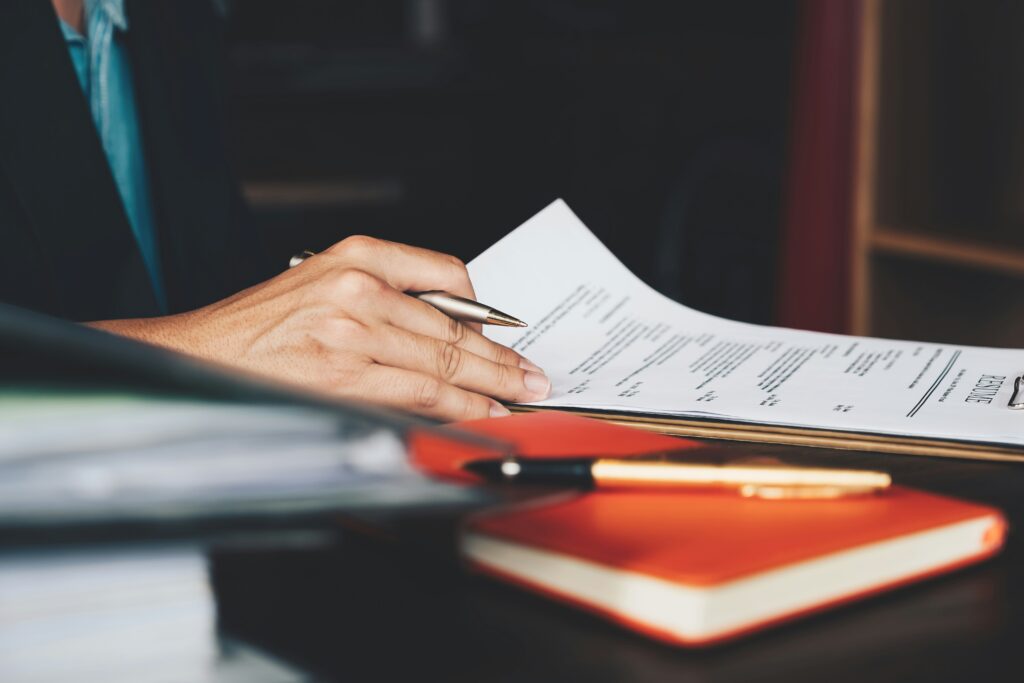 Professional workspace with resume, notebook, and Bible, representing a faith-based resume and career alignment