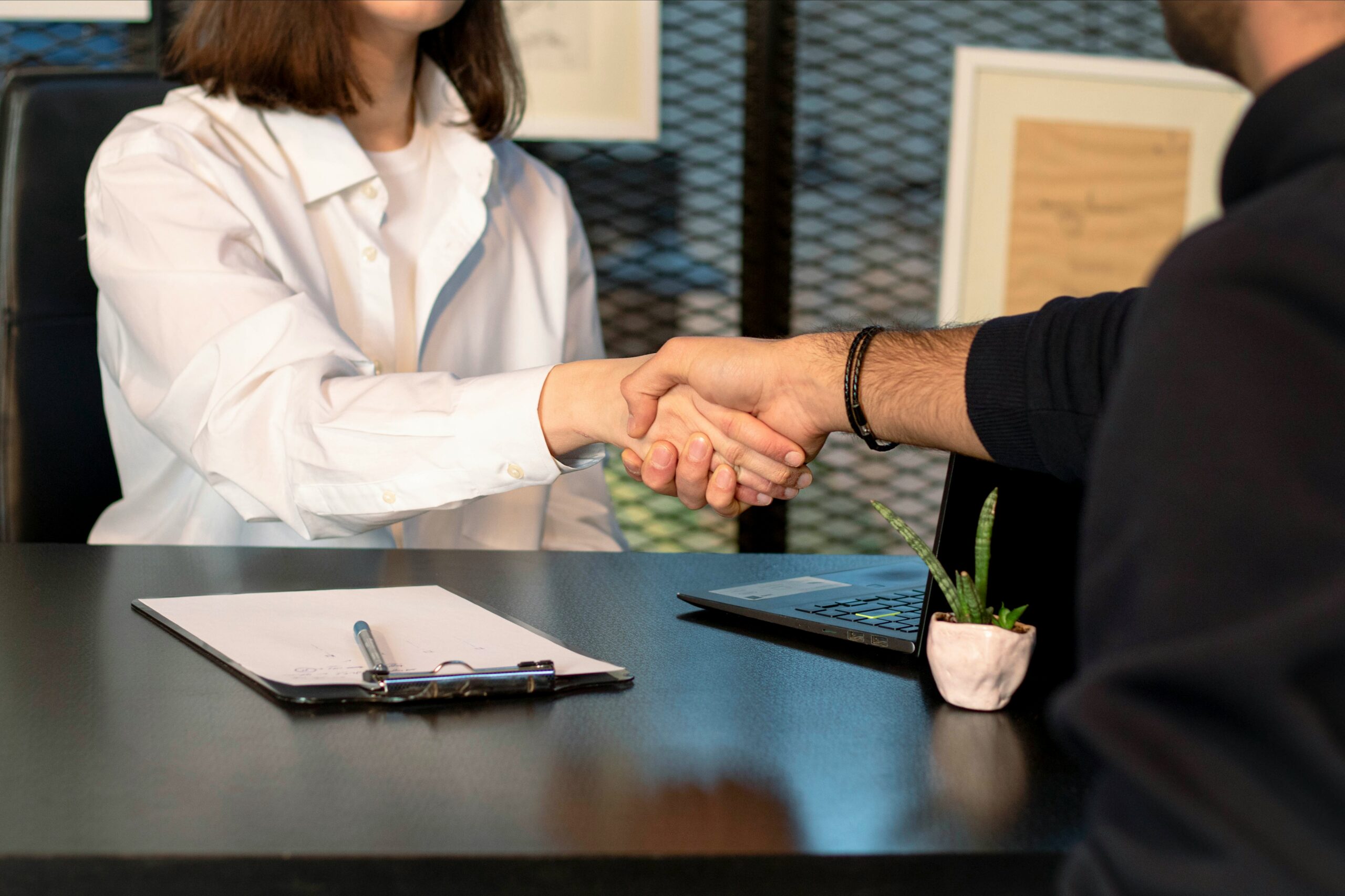 faith-based-interview-preparation-job-candidate-office.jpg A professionally dressed job candidate confidently walking toward an office building before an interview.