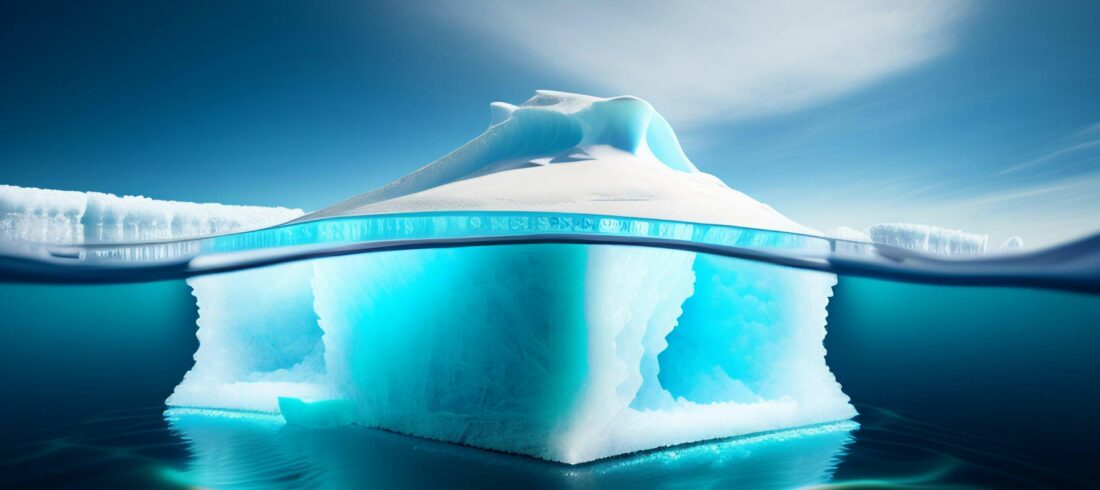 Iceberg floating in the ocean with a small portion visible above the water and a much larger section hidden below, illustrating how organizational health issues often remain unseen until a crisis reveals them.